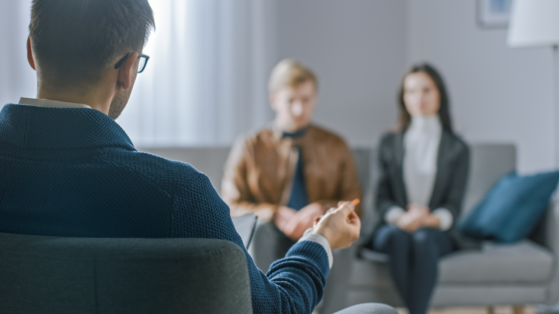 Counselor holding session with two women.